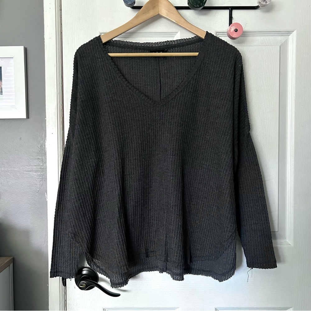 Oversized raw hem v neck sweater